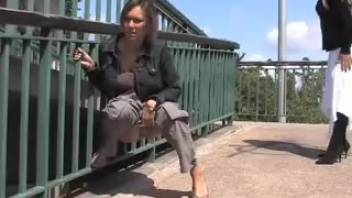 A young woman anticipates her female friend urinating